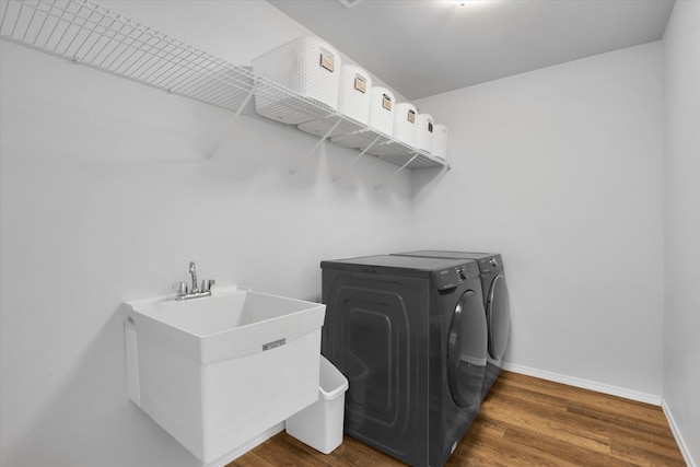 10521 W Salmonberry Rd, Cheney, WA 99004 - laundry area with independent washer and dryer and dark wood finished floors
