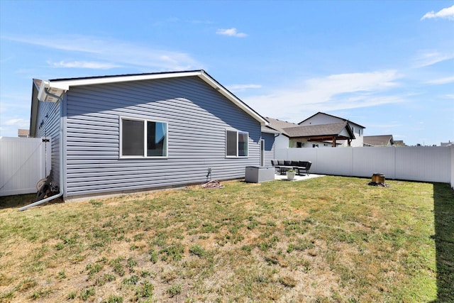 10521 W Salmonberry Rd, Cheney, WA 99004 - back of property featuring outdoor lounge area, a fenced backyard, and a patio area