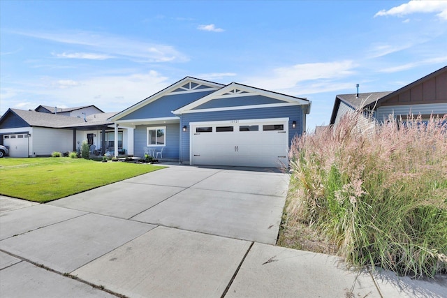 10521 W Salmonberry Rd, Cheney, WA 99004 - view of front of property featuring a garage, driveway, and a front lawn