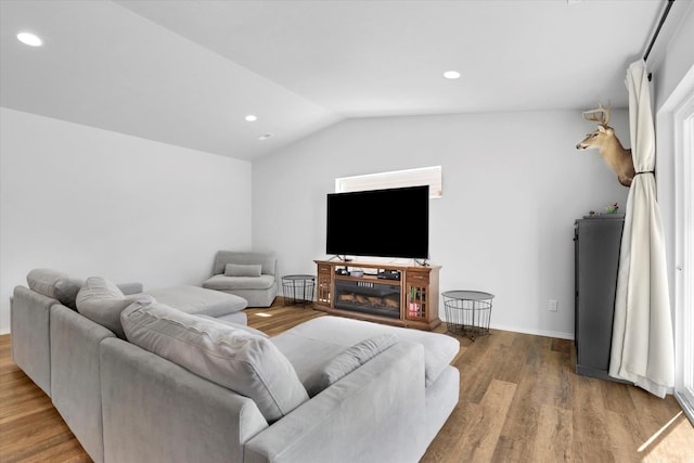 10521 W Salmonberry Rd, Cheney, WA 99004 - living room featuring vaulted ceiling, wood finished floors, and recessed lighting