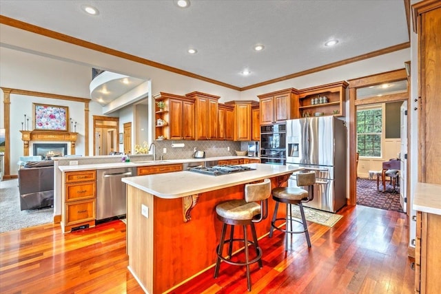 6808 S Jackson Ridge Ln, Greenacres, WA 99016 - kitchen featuring appliances with stainless steel finishes, open shelves, light wood-style flooring, brown cabinets, and ornamental molding