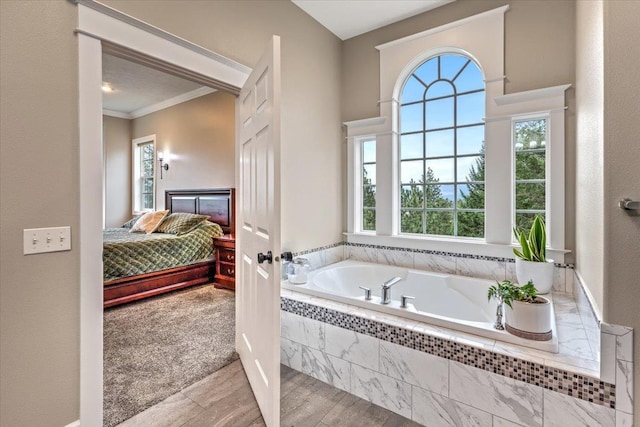 6808 S Jackson Ridge Ln, Greenacres, WA 99016 - ensuite bathroom featuring plenty of natural light, a garden tub, wood finished floors, and ornamental molding