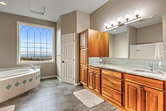 6808 S Jackson Ridge Ln, Greenacres, WA 99016 - full bathroom with double vanity, a garden tub, and backsplash