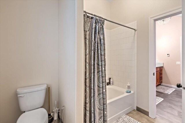 6808 S Jackson Ridge Ln, Greenacres, WA 99016 - bathroom featuring vanity, shower / bathtub combination with curtain, and wood finished floors