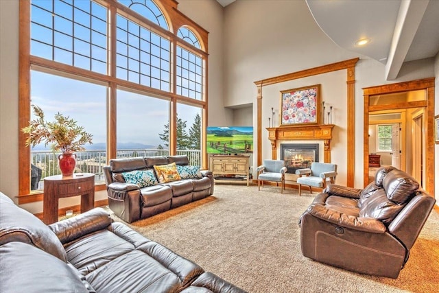 6808 S Jackson Ridge Ln, Greenacres, WA 99016 - living area with carpet floors, a high ceiling, and a glass covered fireplace