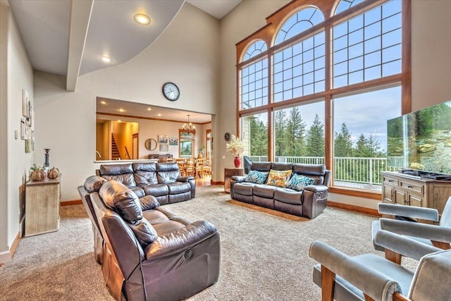 6808 S Jackson Ridge Ln, Greenacres, WA 99016 - living room with carpet flooring, a high ceiling, recessed lighting, and a chandelier
