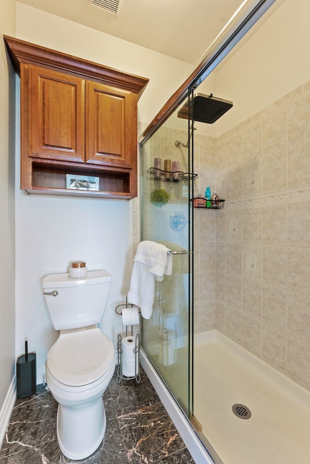 8708 E Redwood Ln, Spokane, WA 99217 - bathroom with a shower stall and marble look tiles