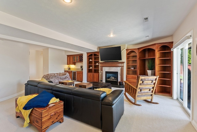 8708 E Redwood Ln, Spokane, WA 99217 - living room featuring light colored carpet, a fireplace with flush hearth, and recessed lighting