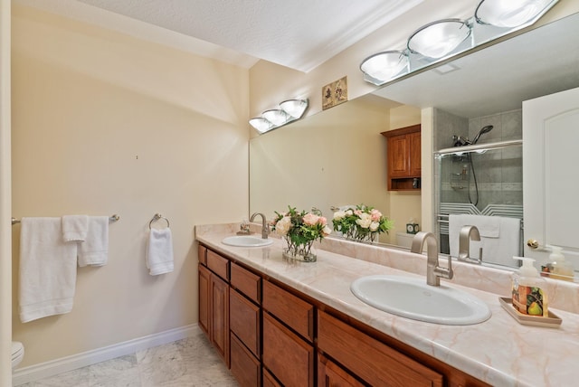 8708 E Redwood Ln, Spokane, WA 99217 - full bath featuring double vanity, a stall shower, and marble finish flooring