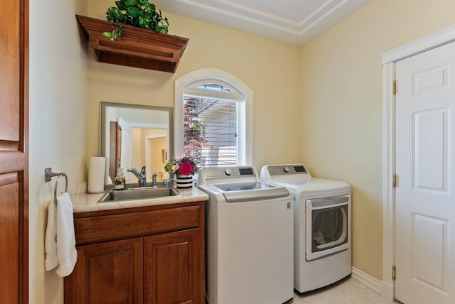 8708 E Redwood Ln, Spokane, WA 99217 - laundry area featuring washer and clothes dryer, cabinet space, and light tile patterned flooring