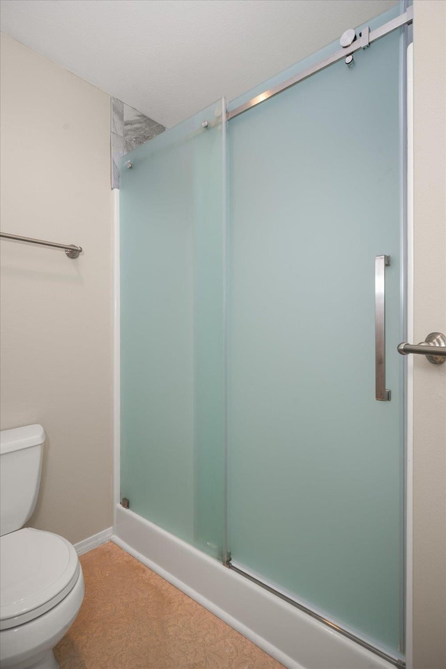6419 W Skagit Ave, Spokane, WA 99208 - bathroom featuring a stall shower and toilet