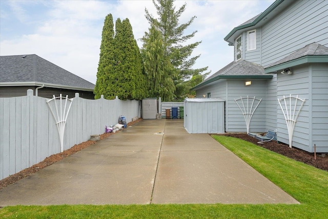6419 W Skagit Ave, Spokane, WA 99208 - view of patio featuring driveway and a shed