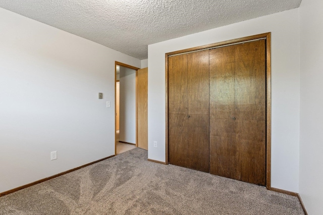 13908 E 32nd Ave, Spokane Valley, WA 99037 - unfurnished bedroom with carpet, a closet, and a textured ceiling