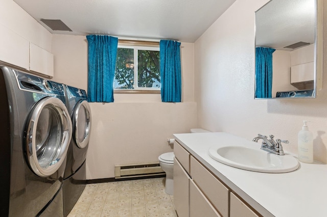 13908 E 32nd Ave, Spokane Valley, WA 99037 - bathroom featuring baseboard heating, separate washer and dryer, vanity, and tile patterned floors