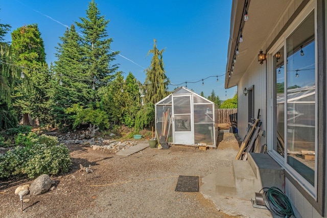 13908 E 32nd Ave, Spokane Valley, WA 99037 - view of yard featuring a greenhouse and an outdoor structure