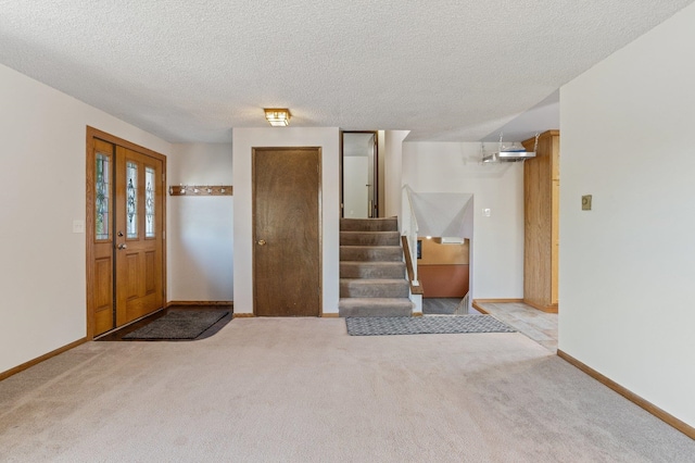 13908 E 32nd Ave, Spokane Valley, WA 99037 - carpeted entryway with a textured ceiling and stairs