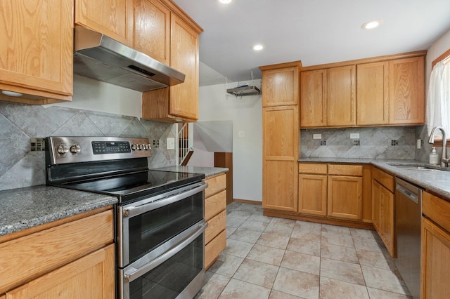 13908 E 32nd Ave, Spokane Valley, WA 99037 - kitchen with appliances with stainless steel finishes, extractor fan, backsplash, recessed lighting, and stone counters