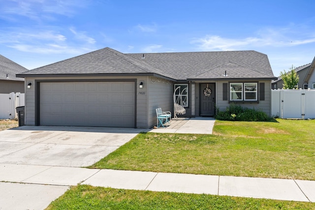 19020 E Euclid Ave, Otis Orchards, WA 99037 - view of front facade with a gate, a garage, driveway, and a shingled roof
