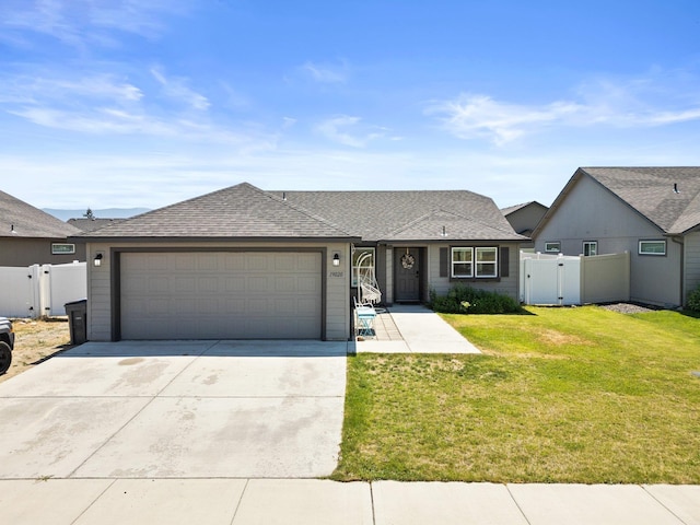 19020 E Euclid Ave, Otis Orchards, WA 99037 - view of front of house with an attached garage, concrete driveway, a gate, and roof with shingles