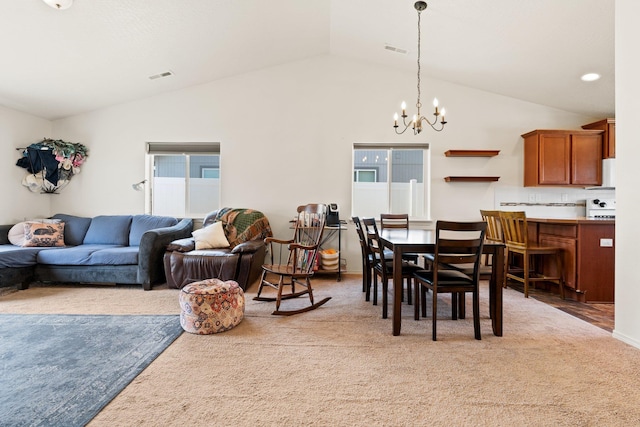 19020 E Euclid Ave, Otis Orchards, WA 99037 - carpeted dining room with lofted ceiling and a chandelier