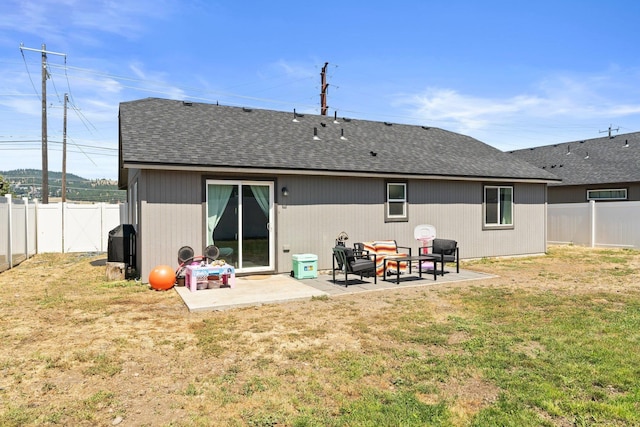 19020 E Euclid Ave, Otis Orchards, WA 99037 - back of property featuring a patio area, roof with shingles, and a fenced backyard
