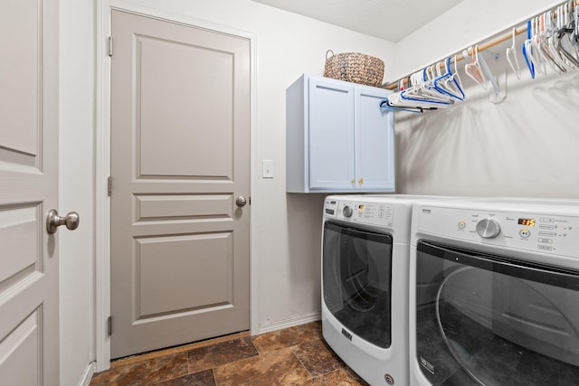 19020 E Euclid Ave, Otis Orchards, WA 99037 - laundry area featuring separate washer and dryer, cabinet space, and dark stone finish floors