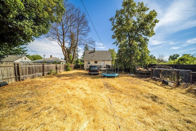 803 E Queen Ave, Spokane, WA 99207 - fenced backyard featuring a trampoline