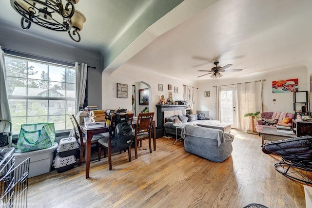 803 E Queen Ave, Spokane, WA 99207 - living area with arched walkways, light wood finished floors, and ceiling fan