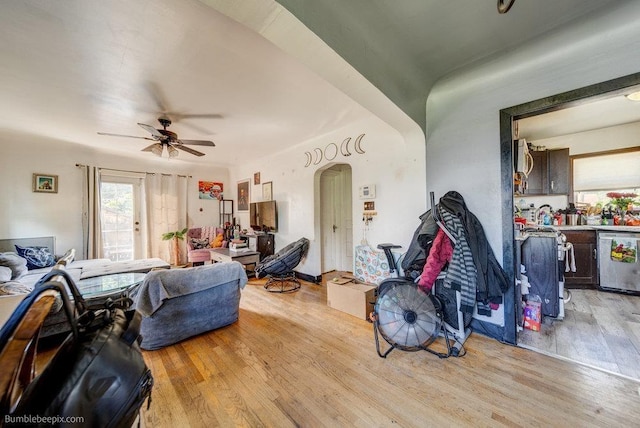 803 E Queen Ave, Spokane, WA 99207 - living room with light wood-type flooring, arched walkways, and ceiling fan