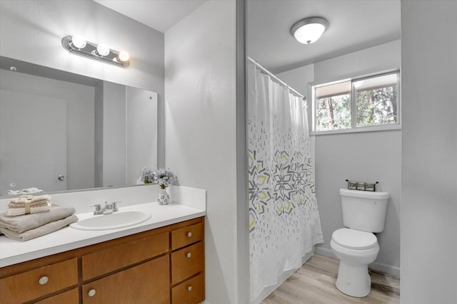 13709 E 30th Ave, Spokane Valley, WA 99216 - bathroom featuring vanity, wood finished floors, and curtained shower