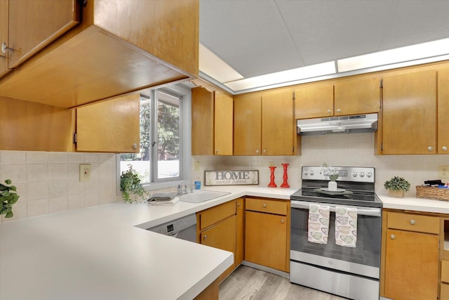 13709 E 30th Ave, Spokane Valley, WA 99216 - kitchen with stainless steel appliances, under cabinet range hood, light countertops, and backsplash