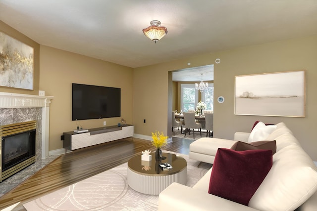 1428 E 18th Ave, Spokane, WA 99203 - living room featuring wood finished floors, a chandelier, and a premium fireplace