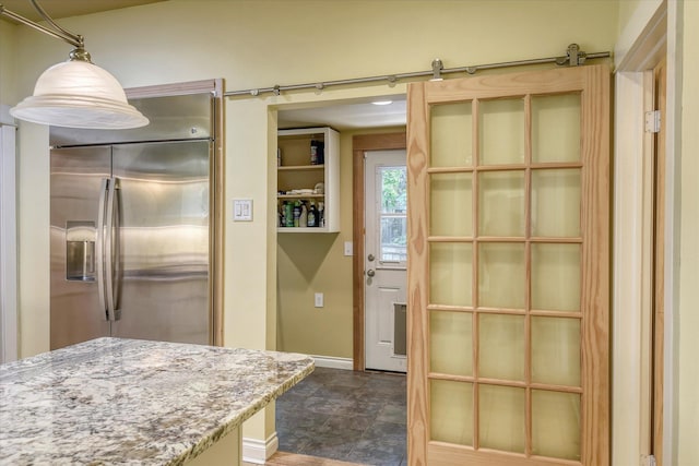 1428 E 18th Ave, Spokane, WA 99203 - kitchen with stainless steel fridge with ice dispenser, light stone countertops, and stone finish flooring
