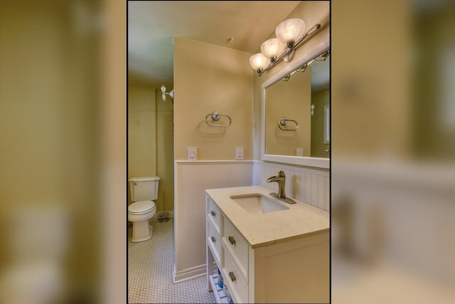 1428 E 18th Ave, Spokane, WA 99203 - full bathroom with vanity, wainscoting, tile patterned flooring, and a shower