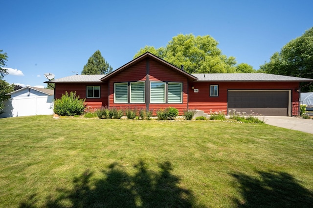 447 E Dakota Ave, Hayden, ID 83835 - view of front of property with an attached garage and concrete driveway