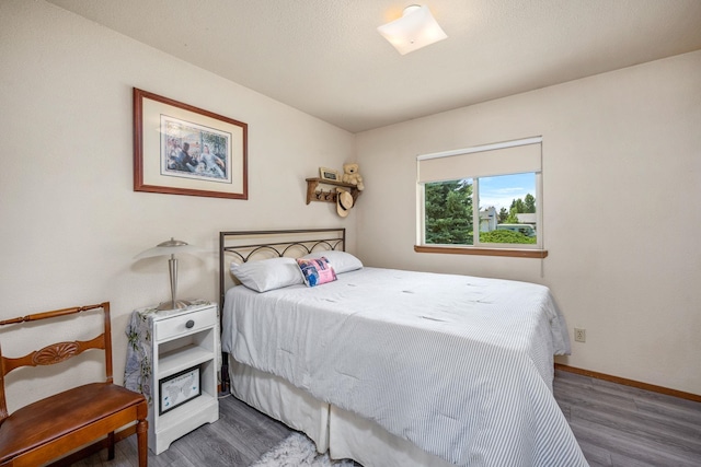 447 E Dakota Ave, Hayden, ID 83835 - bedroom featuring wood finished floors and baseboards