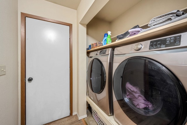 447 E Dakota Ave, Hayden, ID 83835 - laundry room with separate washer and dryer and light wood-type flooring