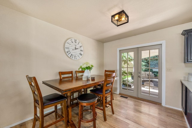 447 E Dakota Ave, Hayden, ID 83835 - dining room featuring french doors and light wood-type flooring