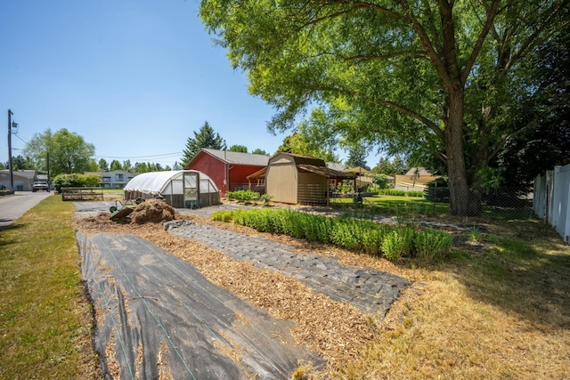 447 E Dakota Ave, Hayden, ID 83835 - view of front of home featuring a greenhouse and an outbuilding