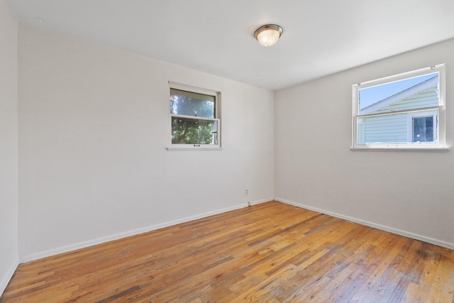 1647 E Decatur Ave, Spokane, WA 99208 - spare room featuring baseboards and light wood-type flooring