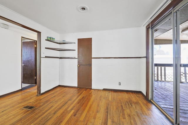 1647 E Decatur Ave, Spokane, WA 99208 - unfurnished bedroom with hardwood / wood-style floors and access to outside