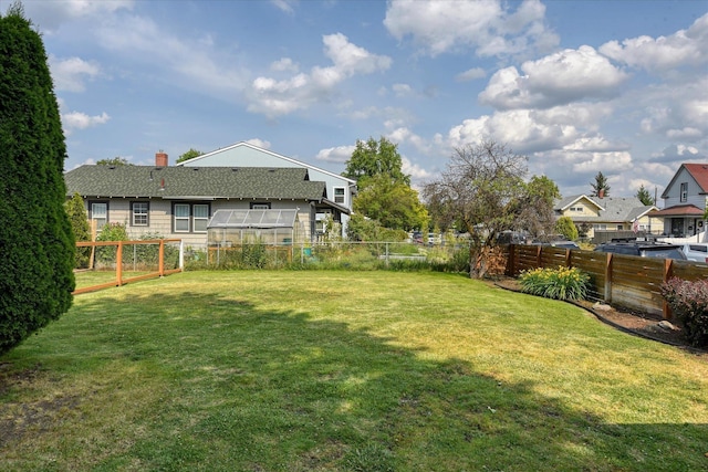 703 E Lacrosse Ave, Spokane, WA 99207 - fenced backyard featuring an exterior structure and an outbuilding