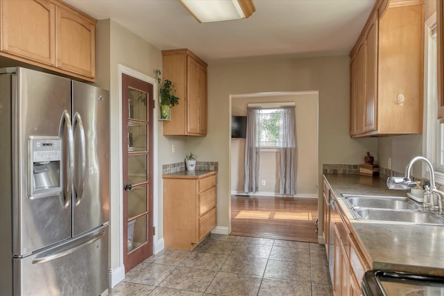 703 E Lacrosse Ave, Spokane, WA 99207 - kitchen with stainless steel refrigerator with ice dispenser and light tile patterned floors
