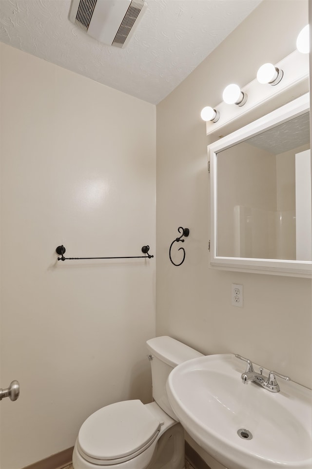 17221 N Little Spokane Dr, Colbert, WA 99005 - bathroom featuring a sink and a textured ceiling