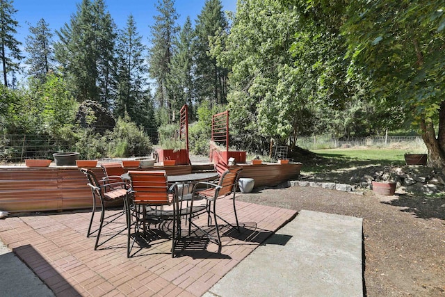 17221 N Little Spokane Dr, Colbert, WA 99005 - view of patio / terrace with outdoor dining space and view of wooded area