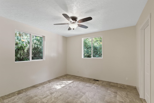 17221 N Little Spokane Dr, Colbert, WA 99005 - spare room with a ceiling fan and a textured ceiling