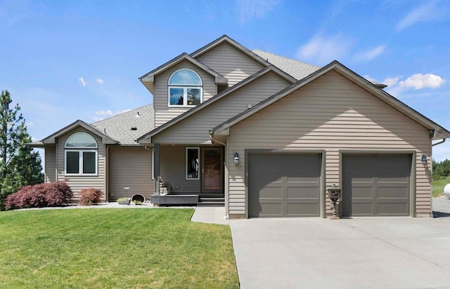 17607 E Judkins Rd, Spokane, WA 99217 - view of front of property with concrete driveway, covered porch, a front lawn, an attached garage, and a shingled roof