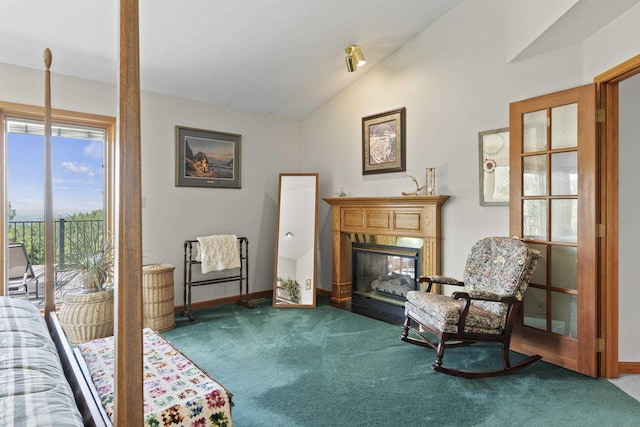 17607 E Judkins Rd, Spokane, WA 99217 - living area with carpet floors, lofted ceiling, and a fireplace with flush hearth