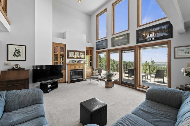 17607 E Judkins Rd, Spokane, WA 99217 - carpeted living room featuring plenty of natural light, a high ceiling, and a fireplace with flush hearth