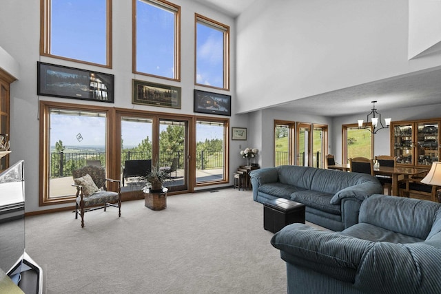 17607 E Judkins Rd, Spokane, WA 99217 - living room with carpet floors, a chandelier, and a high ceiling